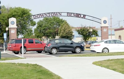 Downtown Bemidji Arch with cars driving by